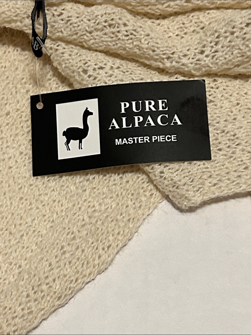 Ivory infinity loop scarf crafted from pure alpaca wool